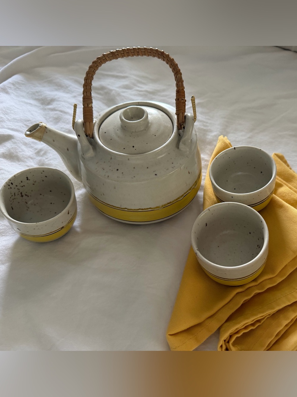1970’s pottery teapot with 3 cups and napkins, yellow and white